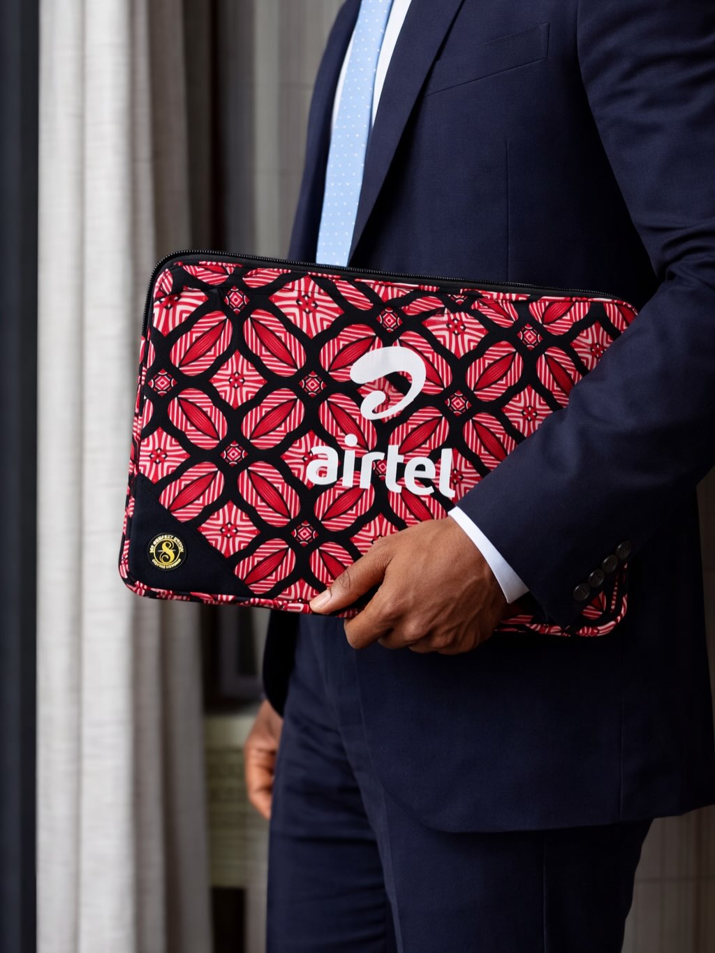 Airtel branded laptop sleeve with handles